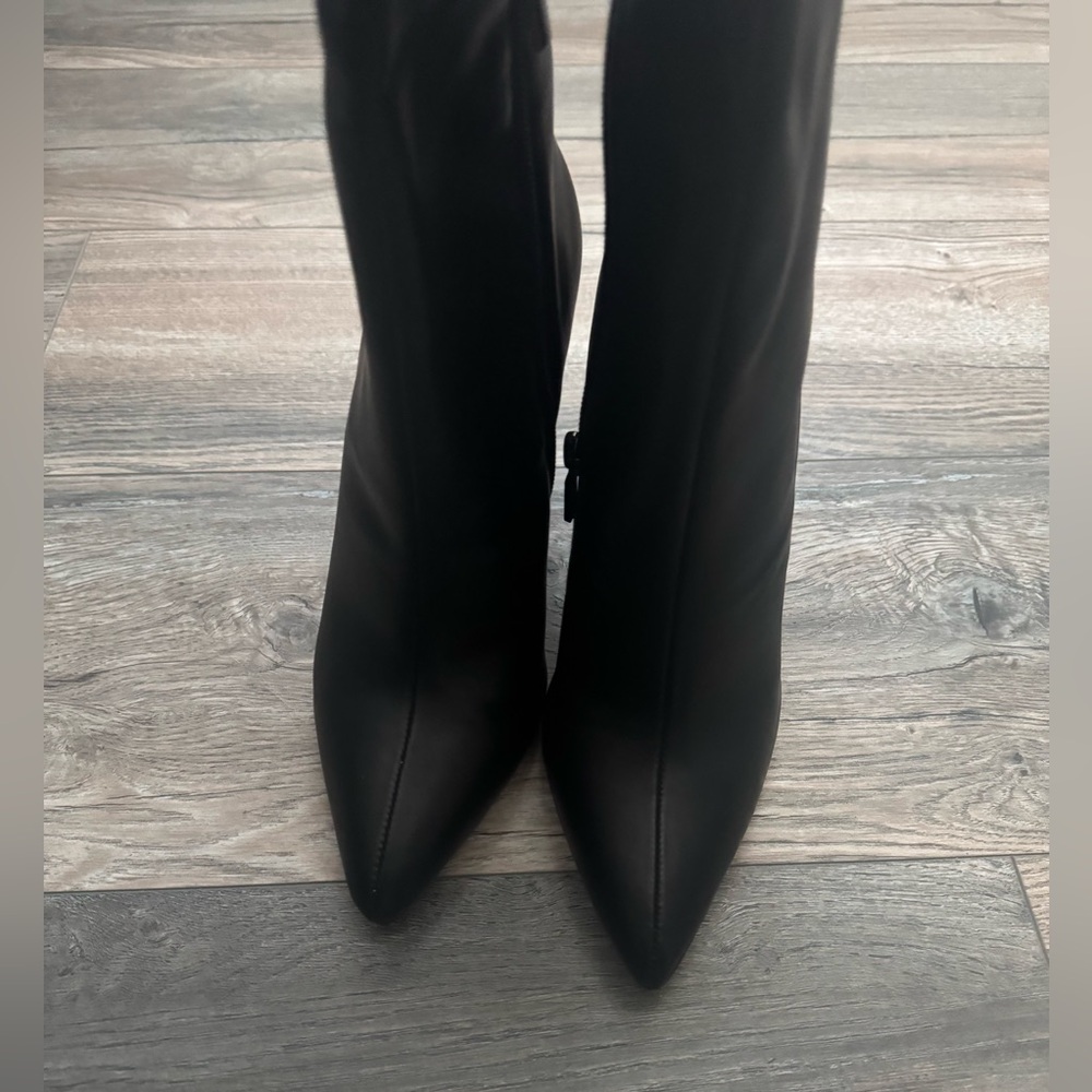 Tall black heeled boots